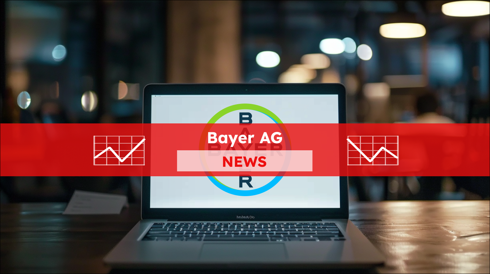 Ein Laptop steht auf einem Tisch, auf dem Bildschirm ist deutlich das Logo von Bayer zu sehen, mit einem Bayer AG NEWS Banner