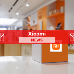 Ein Würfel mit dem Xiaomi-Logo in einem Ladenumfeld, mit elektronischen Geräten im Hintergrund, mit einem Xiaomi NEWS-Banner
