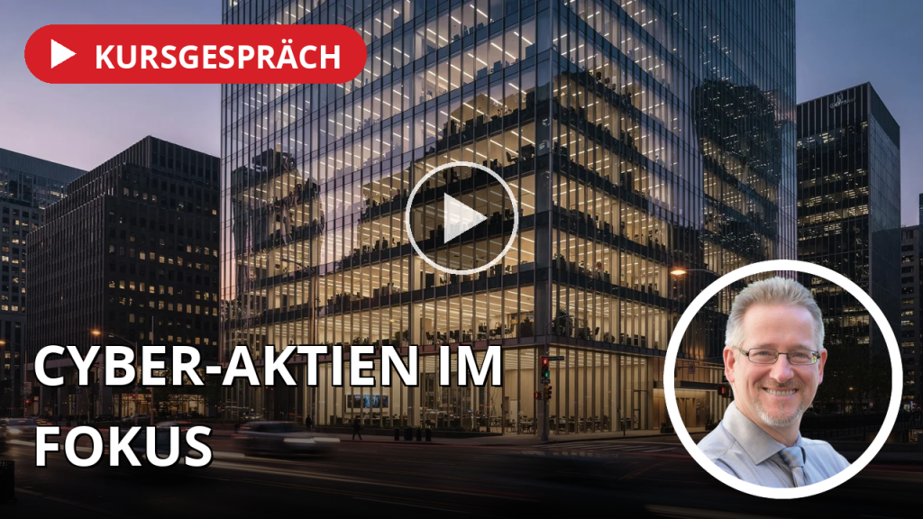 Cyber-Aktien trotzen dem Zins, Zscaler vor dem Ausbruch – Vonovia nach Berlin-Wahl unter Druck Moderne Bürogebäude in einem Finanzviertel bei Dämmerung mit leuchtenden Fenstern.